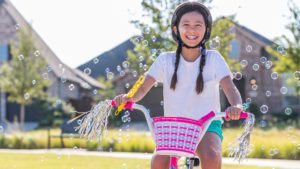 Lilyana Girl on bike with Bubbles